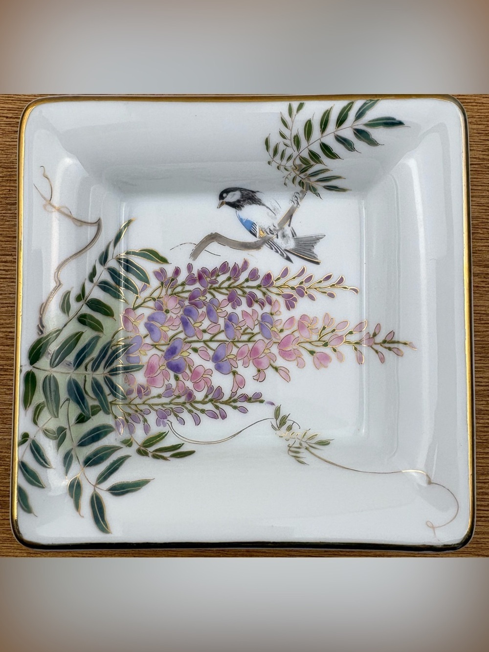 Vintage porcelain candy dish or trinket tray featuring a wisteria and bird motif